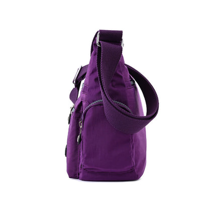 Purple multi pocket crossbody bag for women with adjustable strap and multiple compartments