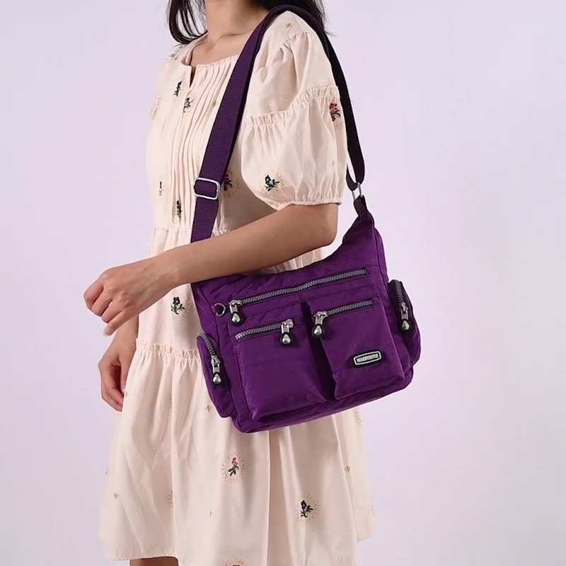 Purple multi pocket crossbody bag for women with adjustable strap and stylish design