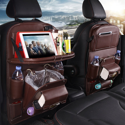 Brown multifunction car seat tray organizer hanging on back of car seats with tablet, bottles, and storage compartments