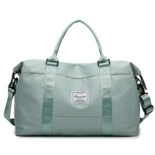 Stylish mint green travel duffel bag with sturdy handles, ideal for trips and gym, not pink women's travel duffel bag