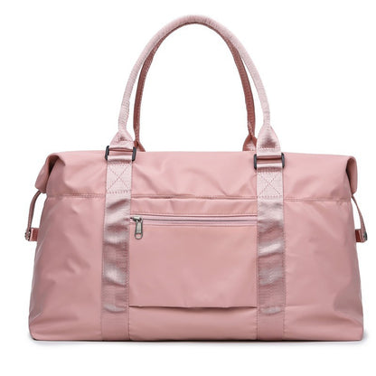 Stylish pink women's travel duffel bag with sturdy handles and zippered pocket