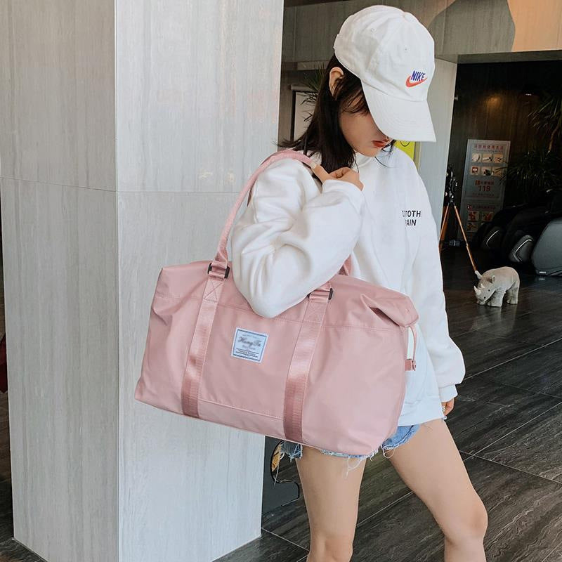 Stylish pink women's travel duffel bag with spacious design for convenient travel