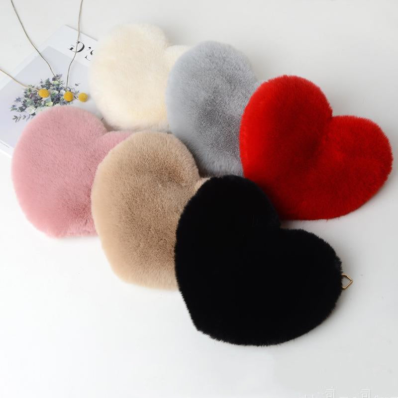 Assorted plush heart shoulder bags for women in various colors and soft textures