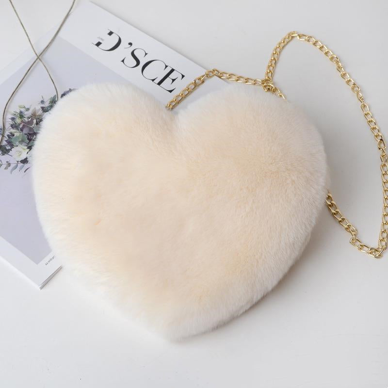 Luxurious plush heart shoulder bag for women in soft beige with a stylish gold chain strap