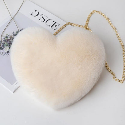 Luxurious plush heart shoulder bag for women in soft beige with a stylish gold chain strap
