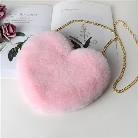 Pink plush heart shoulder bag for women with a gold chain strap for a stylish look