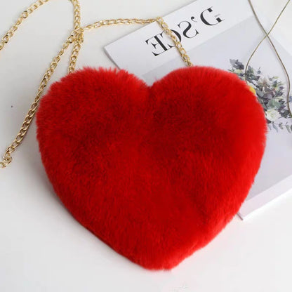 Red plush heart shoulder bag for women with a gold chain strap for stylish outings