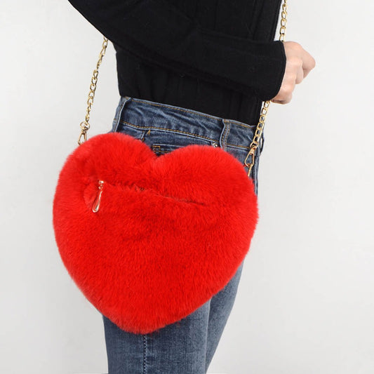 Red plush heart shoulder bag for women with a gold chain strap and zippered pocket