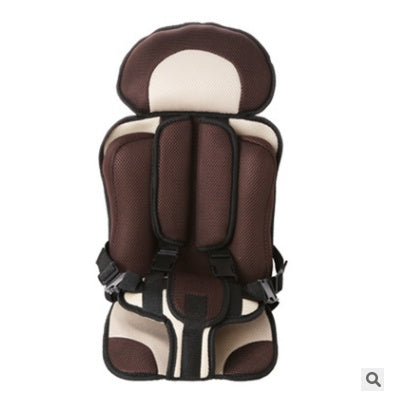 Box of Pandora portable baby car seat in brown and beige with safety harness and cushioned support