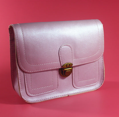 Pink retro buckle shoulder bag with a classic design and secure closure for everyday use