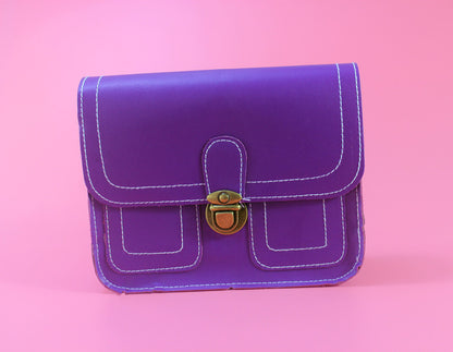Purple retro buckle shoulder bag with a secure brass clasp and contrasting stitching
