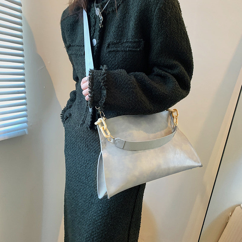 Stylish retro crossbody bag for women in light gray, featuring a unique chain strap.