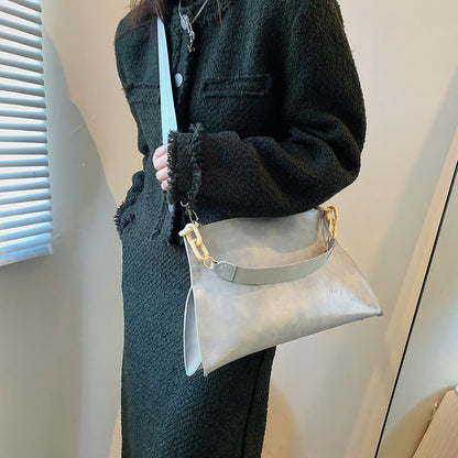 Stylish retro crossbody bag for women in light gray, featuring a unique chain strap.