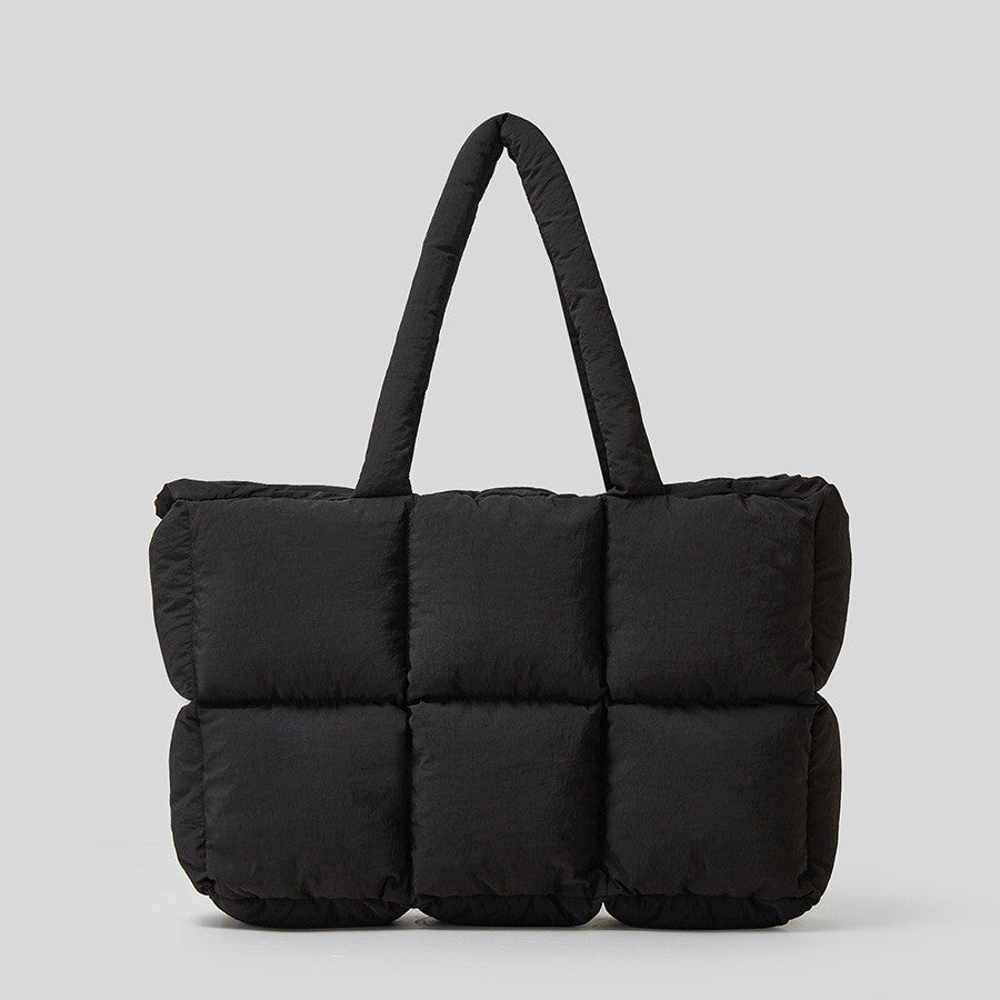 Stylish black soft cotton down handbag with a puffy design and sturdy handles