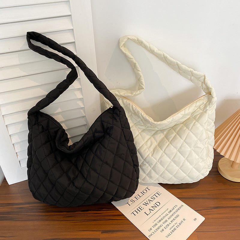 Soft warm shoulder bag for women in black and white quilted design, perfect for everyday use
