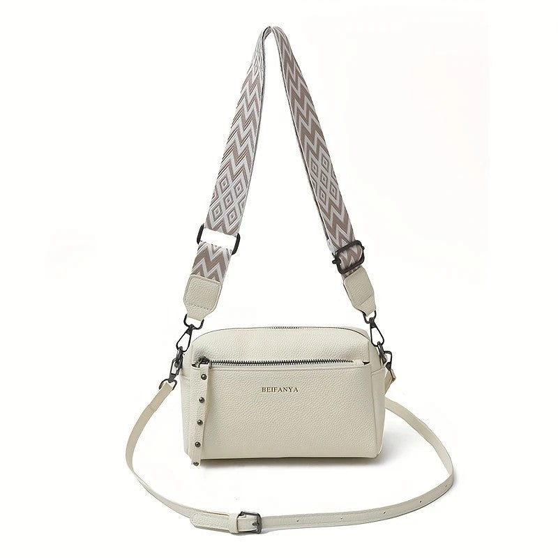 Stylish adjustable shoulder bag women in cream with a patterned strap for casual outings