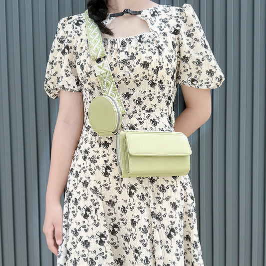 Stylish phone bag for women in light green with matching round coin pouch and patterned strap