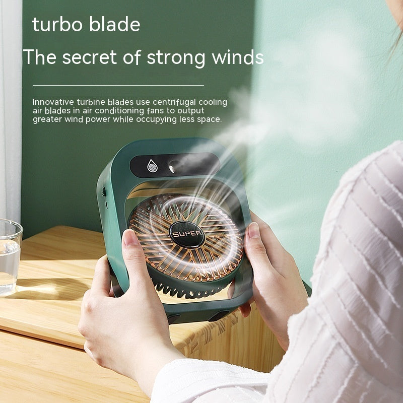 Hangzhou Jingqian green misting USB rechargeable desk fan with turbo blades held over wooden table