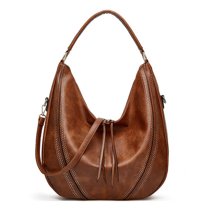 Retro large tote shoulder bag in brown leather with decorative stitching and adjustable strap