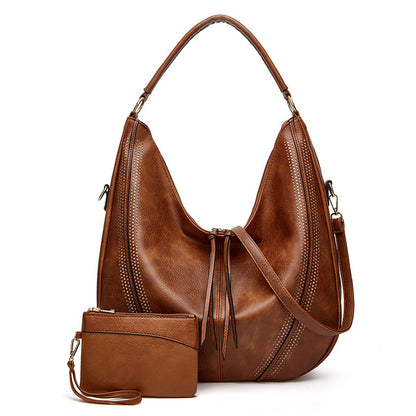 Retro large tote shoulder bag in brown leather with perforated details and matching small pouch