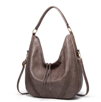Retro large tote shoulder bag in brown leather with perforated design and adjustable strap