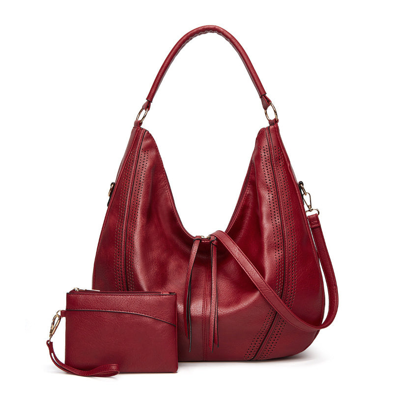 Retro large tote shoulder bag in deep red leather with matching wristlet pouch and adjustable strap