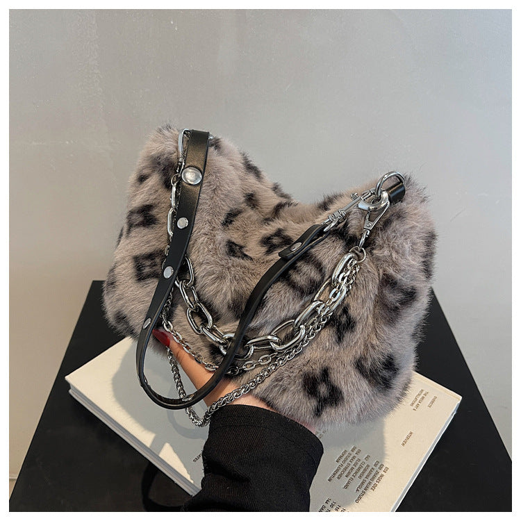 Winter plush floral shoulder bag in soft gray fur with chain and leather straps for a stylish look