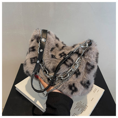 Winter plush floral shoulder bag in soft gray fur with chain and leather straps for a stylish look