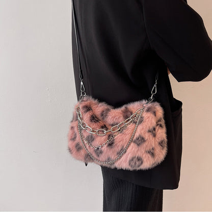 Stylish winter plush floral shoulder bag with pink and black design and chain accents