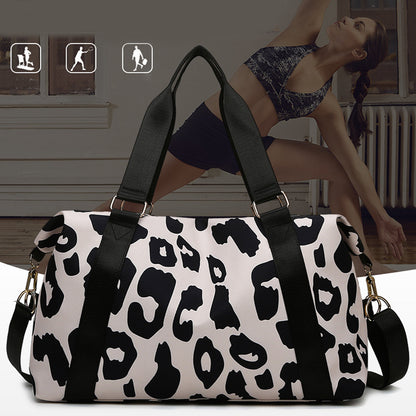 Box of Pandora women’s cow print duffel bag with spacious interior for gym or travel use