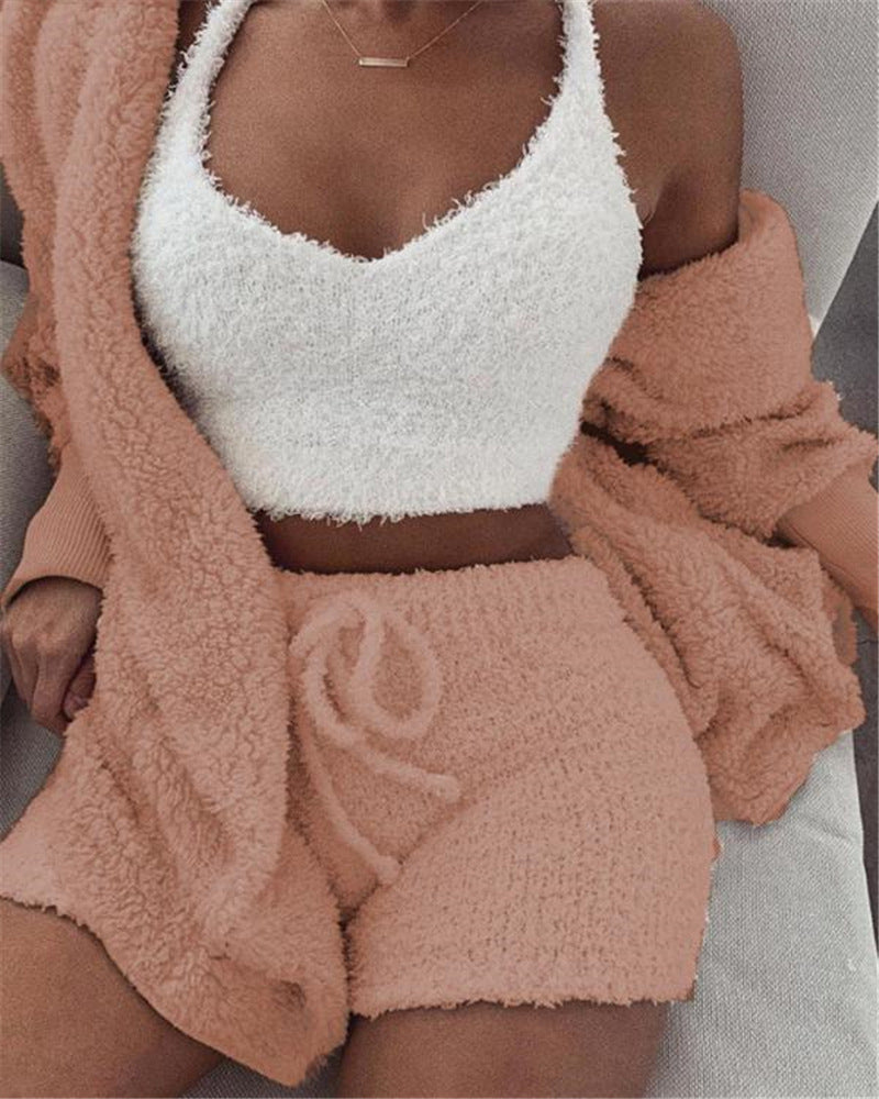 3 piece cozy loungewear outfit featuring a white fuzzy crop tank top, peach shorts, and matching cardigan